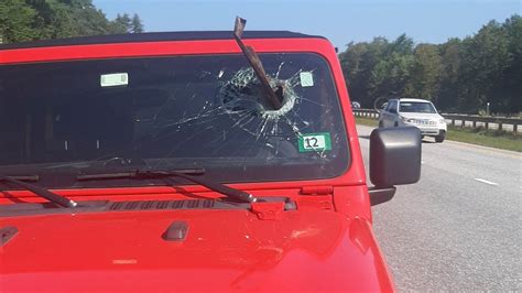 Debris lodges into windshield on Maine Turnpike, coming inches from driver’s face